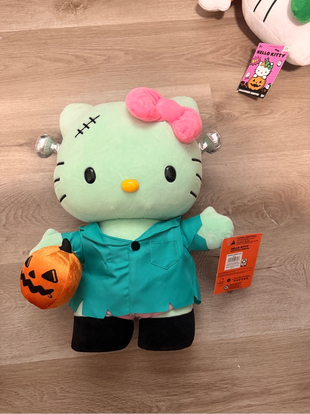 Sanrio Hello Kitty Kids' Green Frankenstein Costume Plush with Pink Bow